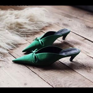 Pointy toe mules with bow tie